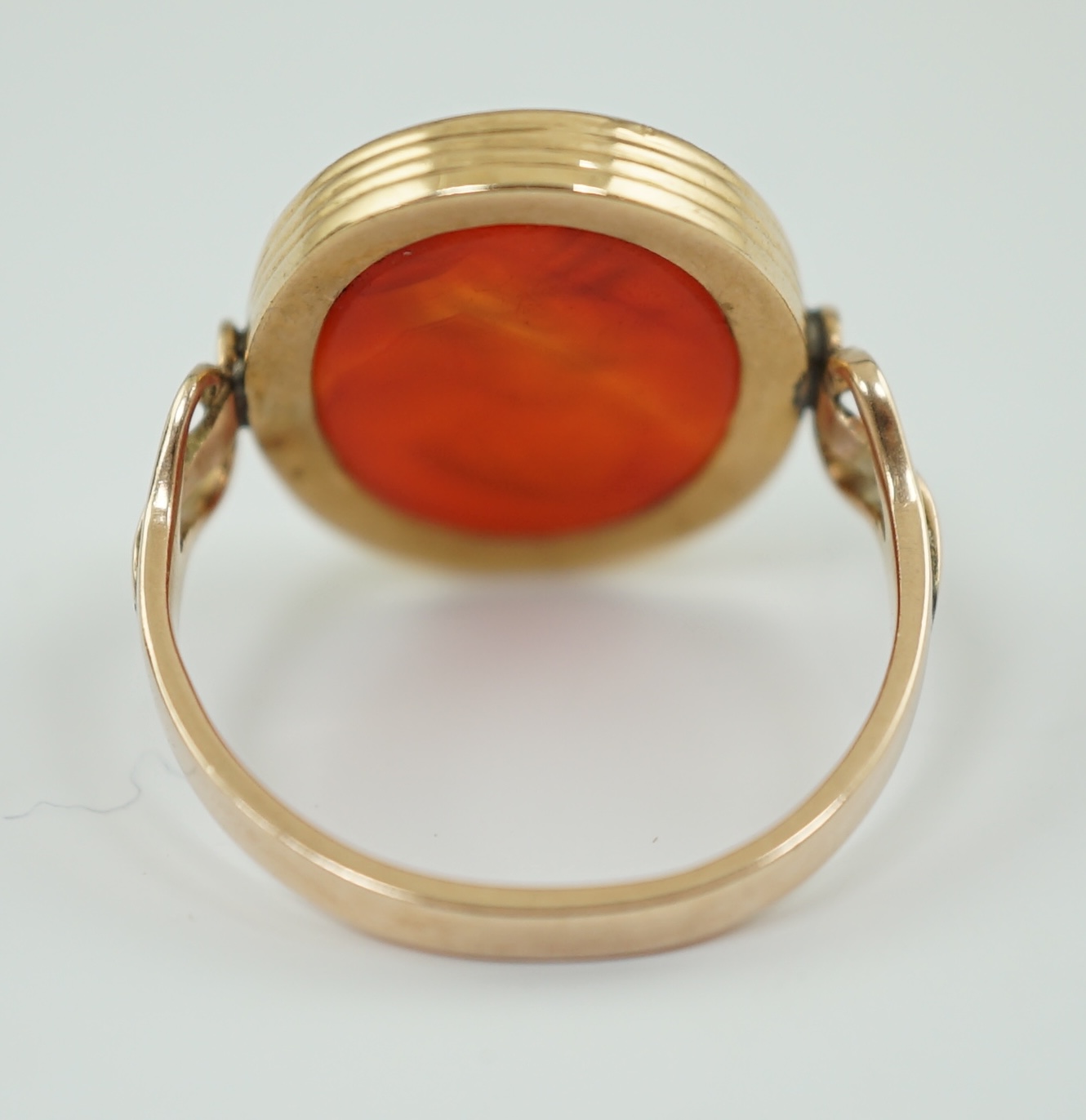 A 19th century gold and intaglio carnelian set oval signet ring